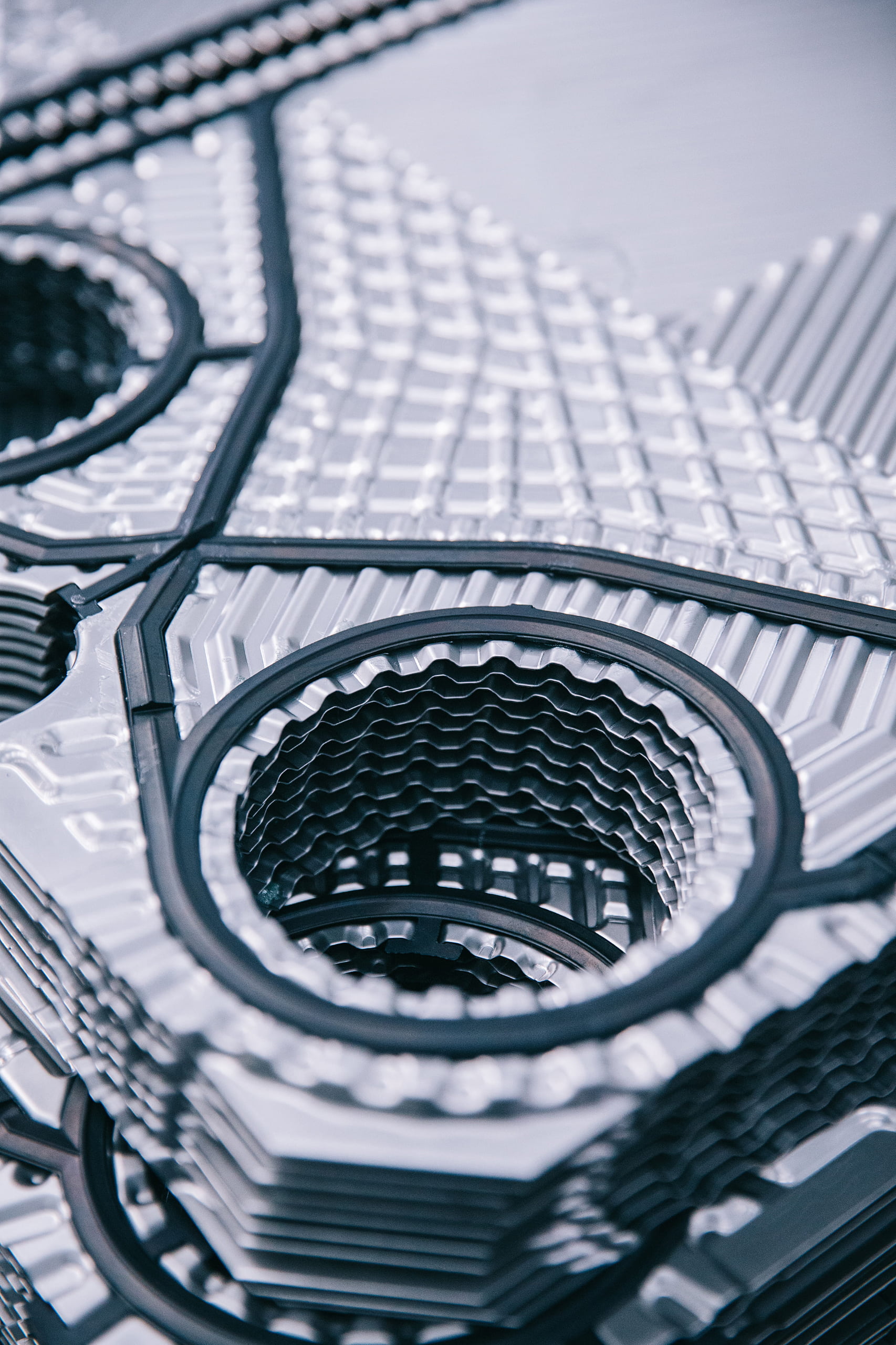 alt text: A collection of TIVO aftermarket plates and gaskets for Alfa Laval M-series heat exchangers