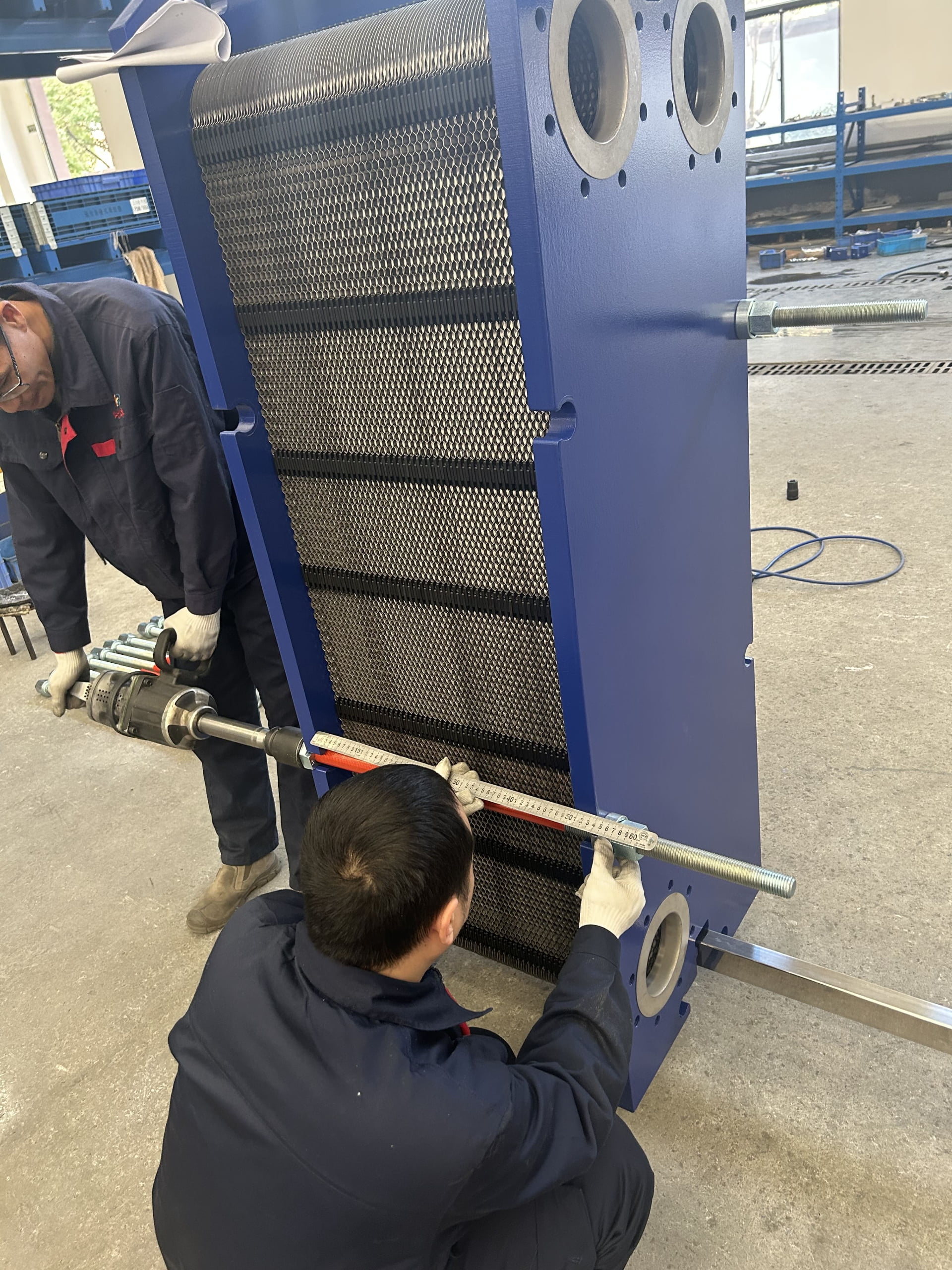 Technician performing maintenance on heat exchanger