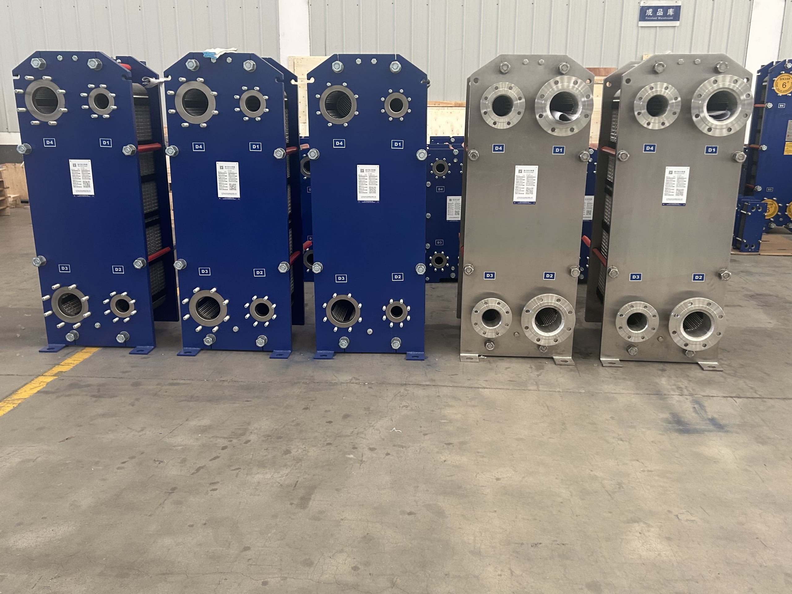 Maintenance engineer inspecting a plate heat exchanger for leaks